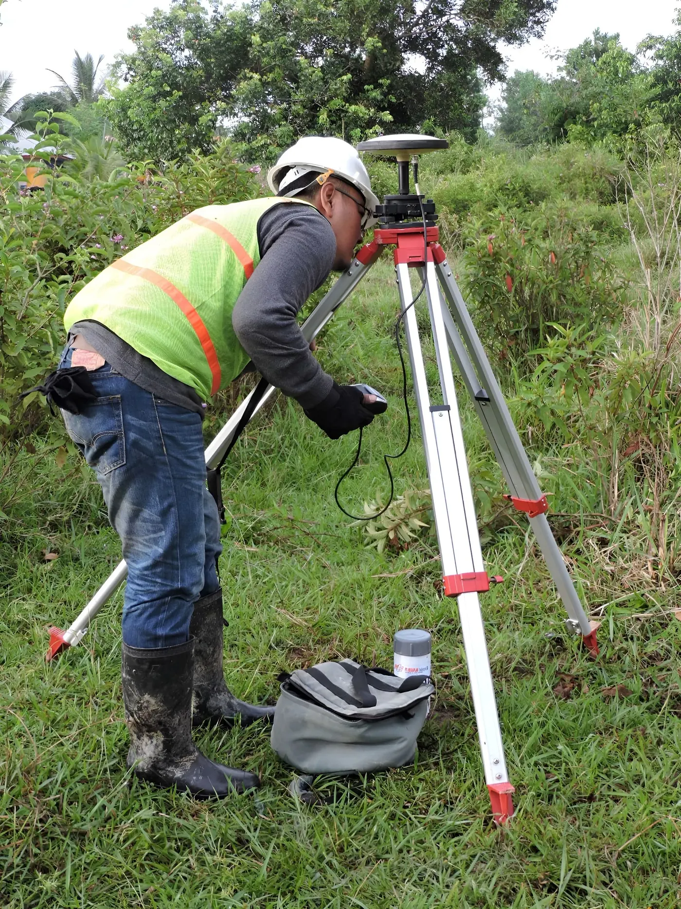 Surveyor measuring a land parcel